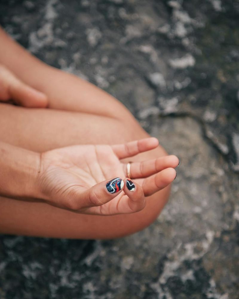 Close-up of hands in a mudra position showing focus and calm